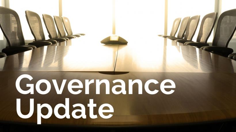 A boardroom meeting table and chairs