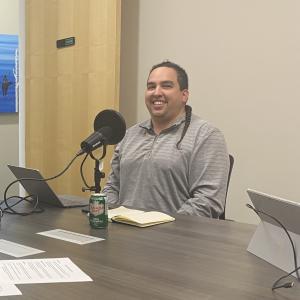 Chelsey and Josh sit at the podcast table